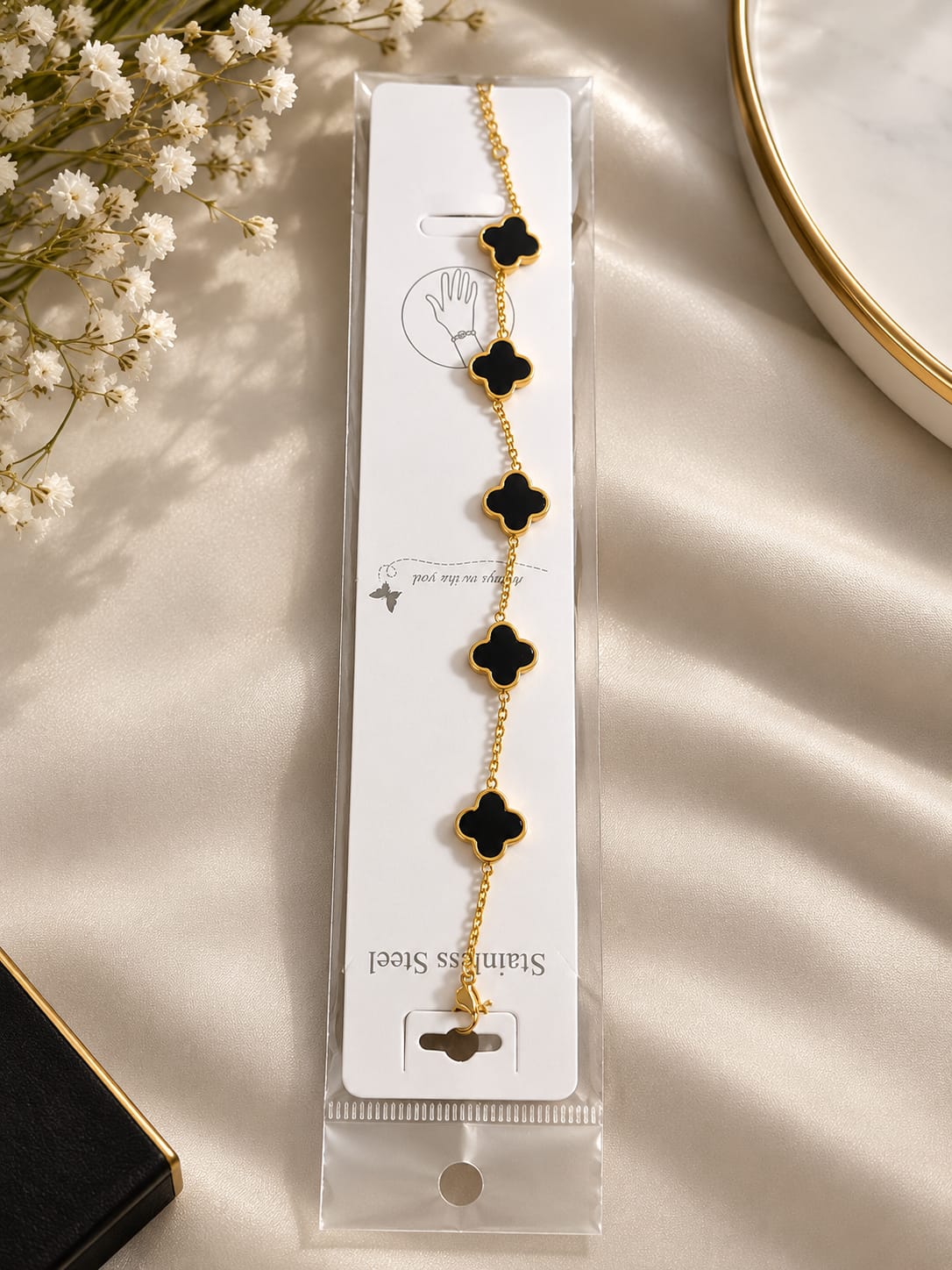 Elegant Gold-Tone Stainless Steel Bracelet with Black Clover Charms