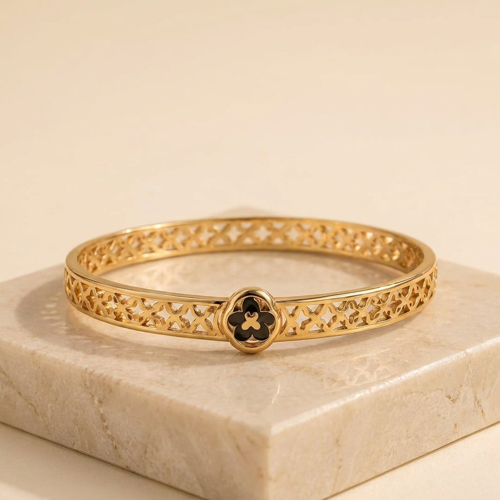 Elegant Gold-Tone Stainless Steel Bangle Bracelet with Black Clover Charm