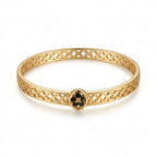 Elegant Gold-Tone Stainless Steel Bangle Bracelet with Black Clover Charm