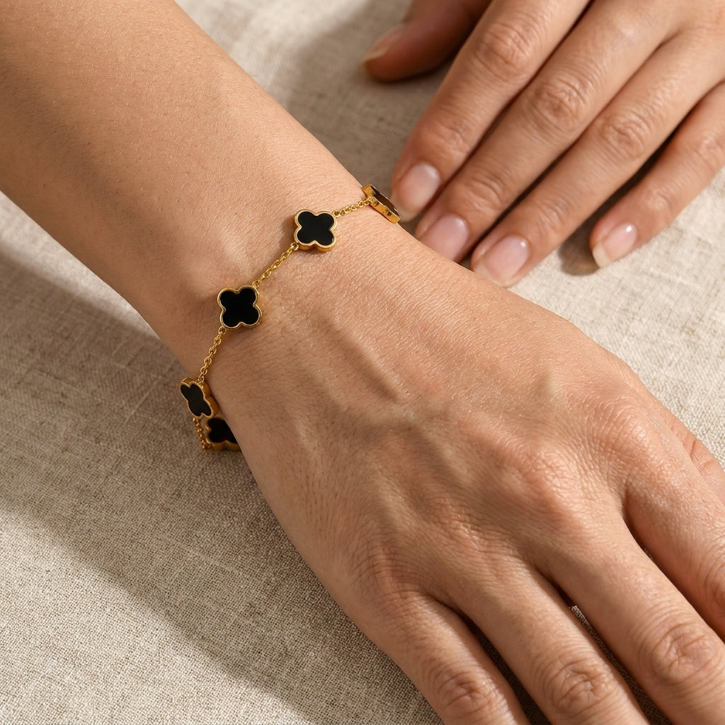 Elegant Gold-Tone Stainless Steel Bracelet with Black Clover Charms
