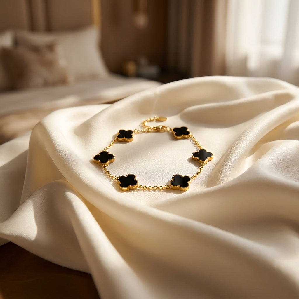 Elegant Gold-Tone Stainless Steel Bracelet with Black Clover Charms