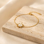 Elegant Gold-Tone Stainless Steel Bracelet with White Floral Charm for Women